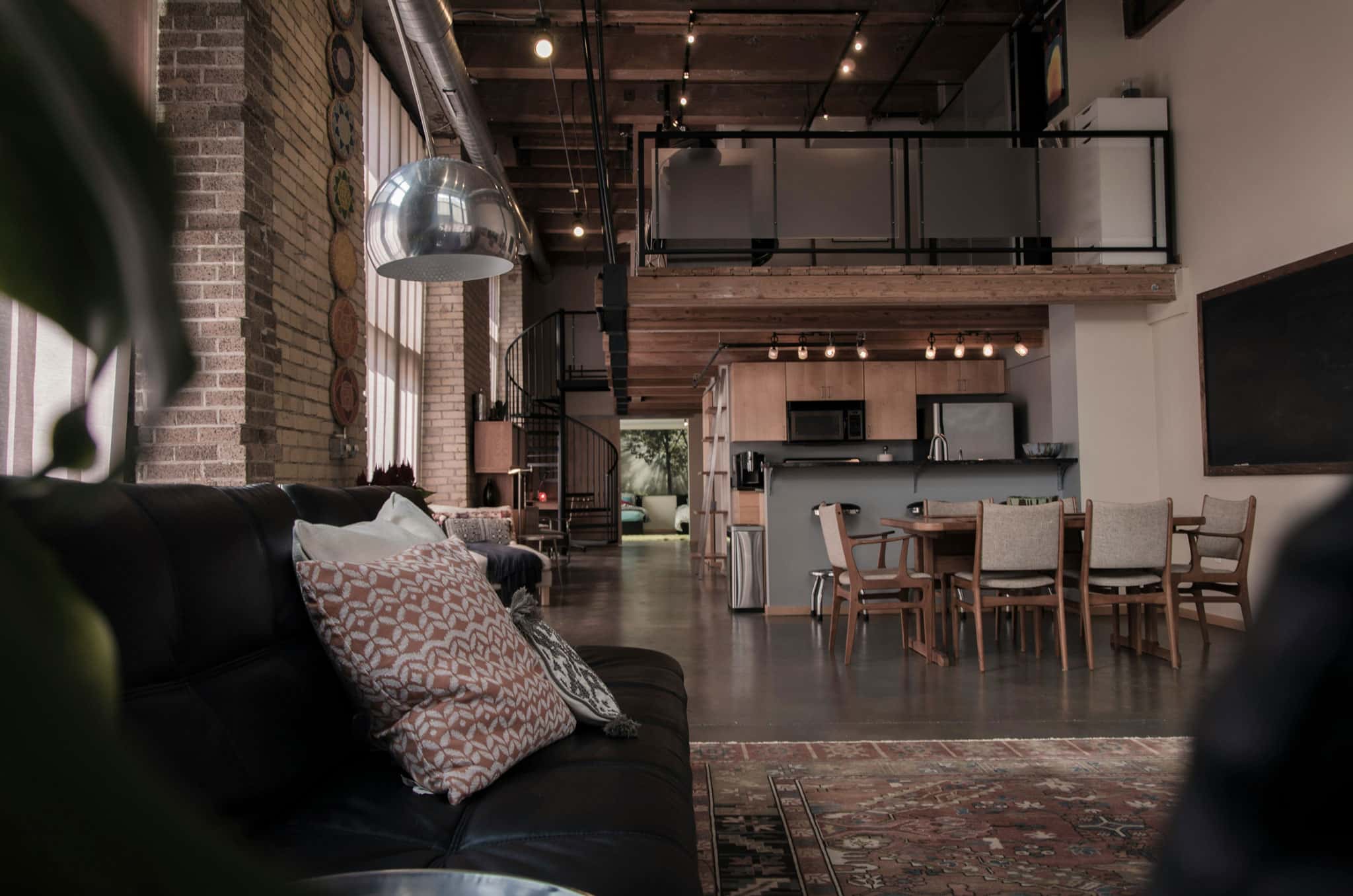 Modern home featuring an elevated loft area above the main living space