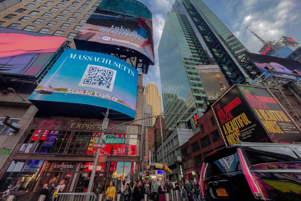Massachusetts QR code billboard in Times Square promoting VisitMA tourism.