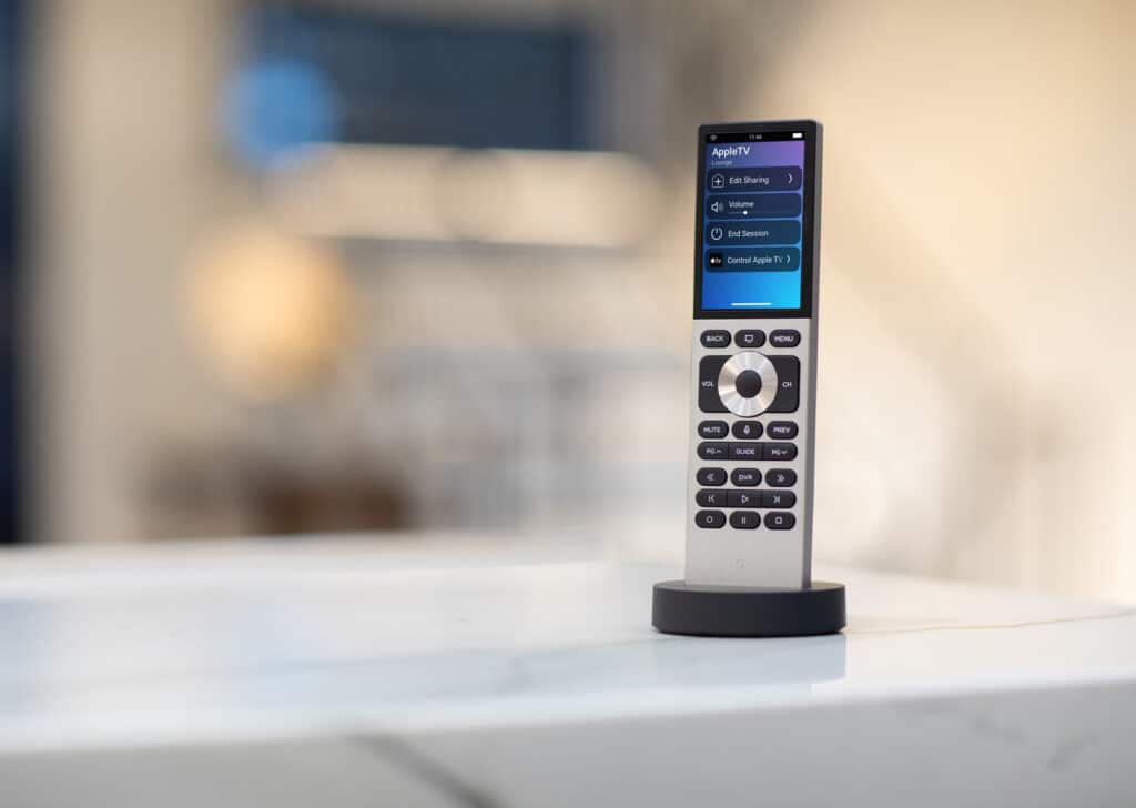 Touchscreen universal remote on a marble surface.