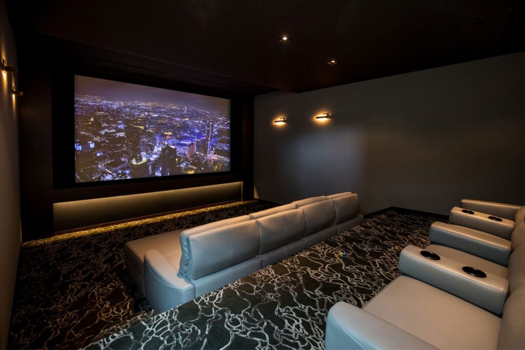 Home Theater AVR with Large Reclining Sofa and Single Upper Seat
