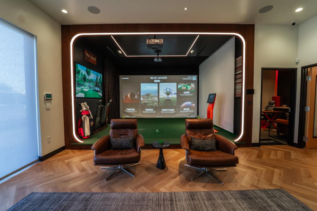Pro-TechT golf simulator installation featuring TrackMan system, integrated lighting, and smart-home controls for training and entertainment