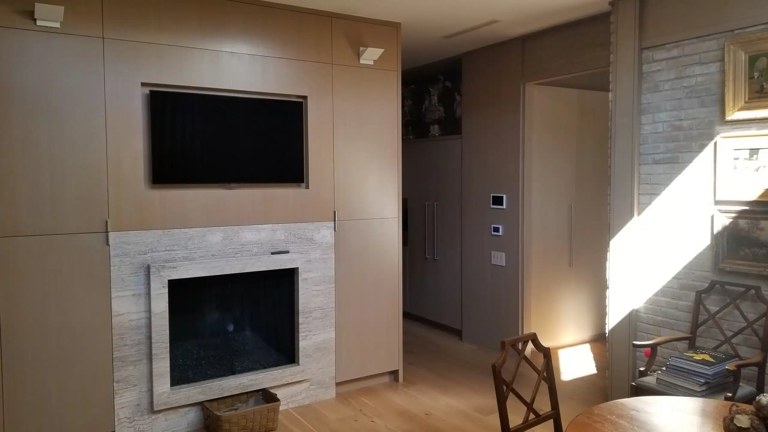 Custom media wall with integrated automation in University Park, TX residence